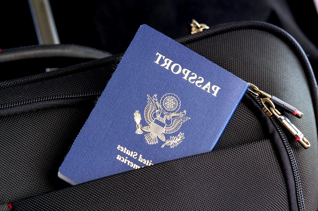 Passport and travel documents on table